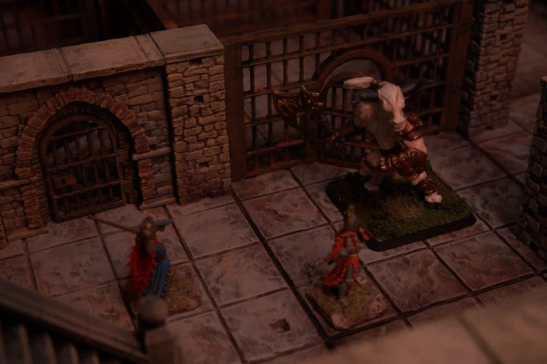 3D Legends modular dungeon tabletop encounter with painted minotaur miniature and iron gatehouse